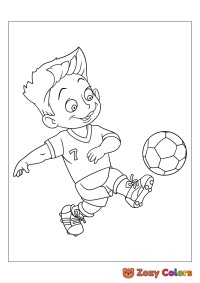 Little boy kicking the football