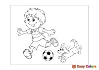 Boy and dog playing football